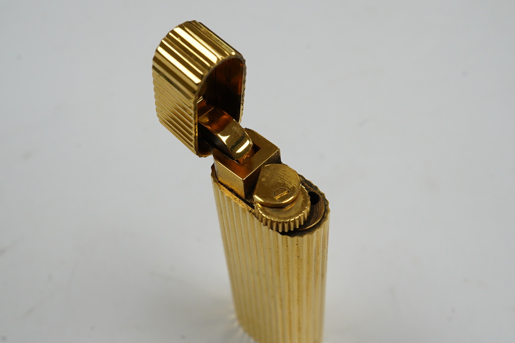 A Dunhill Sylphida lighter and Cartier lighter, numbered 88821. Condition - fair